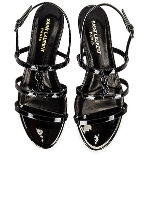 Saint Laurent Cassandra Flat Sandals in Noir - Black. Size 37 (also in 36.5, 37.5, 38, 38.5, 39.5, 40).