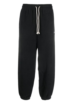 New Balance logo-embroidered fleece track pants - Black