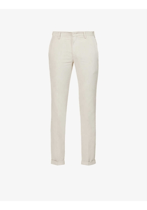 Brand-patch pleated slim-fit tapered cotton trousers