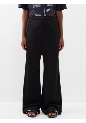 Balenciaga flared cotton cargo trousers, Black