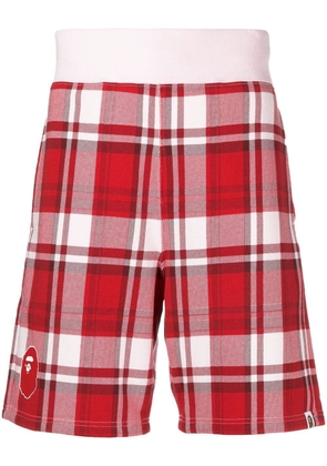 A BATHING APE® tartancheck logo-print shorts - Red
