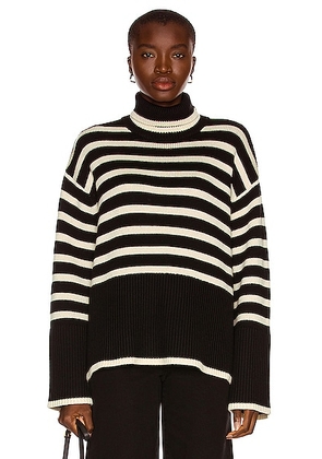 Toteme Signature Stripe Turtleneck Sweater in Black Stripe - Black. Size L (also in M, S, XS).
