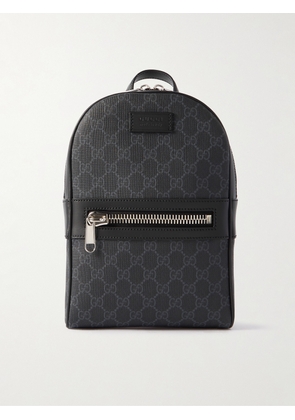 Gucci - Leather-Trimmed Monogrammed Coated-Canvas Sling Backpack - Men - Black