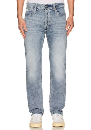 Calvin Klein Slim Straight Jean in Blue. Size 36.