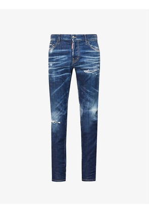 Distressed faded-wash tapered stretch-denim jeans