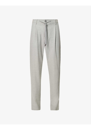 Drawstring-waist pressed-crease high-rise tapered stretch-wool trousers