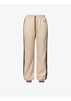 Supreme-print tapered mid-rise jersey jogging bottoms
