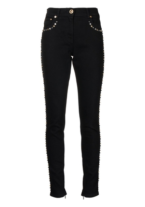 Versace studded slim-cut jeans - Black