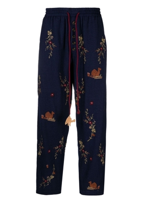 Baziszt Doulich floral-embroidered trousers - Blue