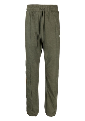 Readymade logo-embroidered striped track pants - Green