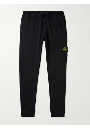 Stone Island - Tapered Logo-Appliquéd Garment-Dyed Cotton-Jersey Sweatpants - Men - Black - S