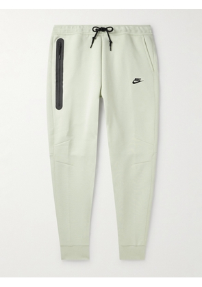 Nike - Tapered Logo-Print Cotton-Blend Tech Fleece Sweatpants - Men - Blue - XS