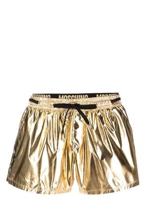 Moschino logo-waistband swim shorts - Gold