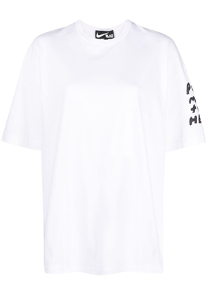 Comme Des Garçons x Nike slogan-print T-shirt - White