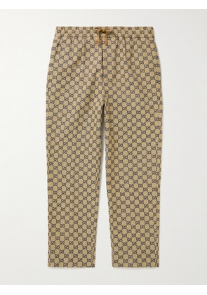 Gucci - Tapered Webbing-Trimmed Monogrammed Cotton-Blend Jacquard Drawstring Trousers - Men - Brown - IT 44