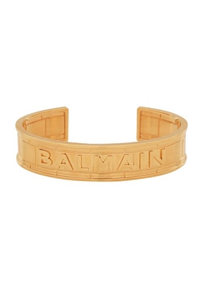 Gold-plated brass cuff bracelet with Balmain logo