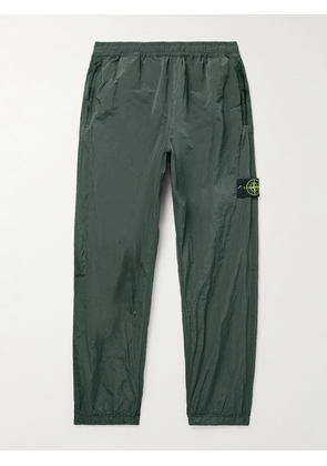 Stone Island - Tapered Logo-Appliquéd ECONYL® Nylon Metal Trousers - Men - Green - UK/US 28