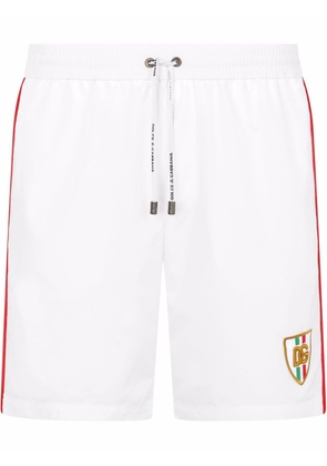 Dolce & Gabbana side-stripe logo swimming shorts - White