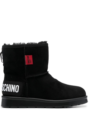 Love Moschino logo-patch exposed-seam ankle boots - Black