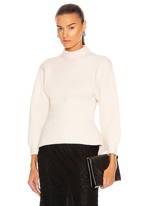 ALAÏA Fitted Sculpted Long Sleeve Sweater in Ivoire - Ivory. Size 36 (also in 38, 40, 42).