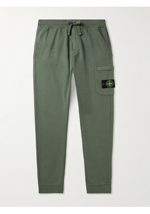 Stone Island - Tapered Logo-Appliquéd Garment-Dyed Cotton-Jersey Sweatpants - Men - Green - S