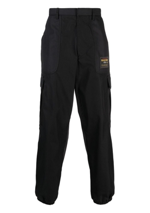 Moschino logo-patch cargo trousers - Black