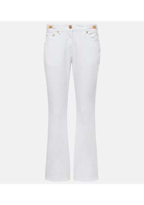 Versace Embellished low-rise flared jeans