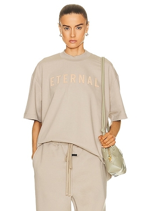 Fear of God Eternal T Shirt in dusty beige - Beige. Size L (also in M, XL/1X, XXL/2X).