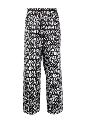 Versace logo-print silk trousers - Black