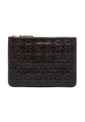 COMME des GARCONS Star Embossed Pouch in Black - Black. Size all.