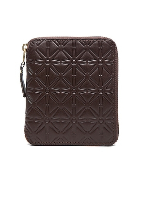 COMME des GARCONS Star Embossed Zip Fold Wallet in Brown - Brown. Size all.