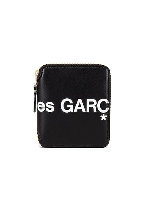 COMME des GARCONS Huge Logo Wallet in Black - Black. Size all.