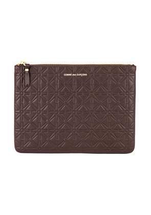 COMME des GARCONS Star Embossed Pouch in Brown - Brown. Size all.
