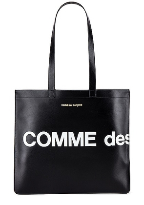 COMME des GARCONS Huge Logo Tote Bag in Black - Black. Size all.