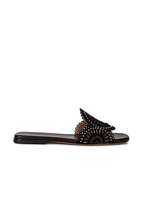 ALAÏA Perforated Molukai Mules in Noir - Black. Size 36 (also in 36.5).