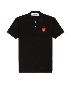 COMME des GARCONS PLAY Polo T-Shirt in Black - Black. Size S (also in L, M, XL/1X).