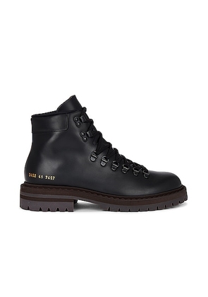 Common Projects Hiking Boot in Black - Black. Size 40 (also in 43).