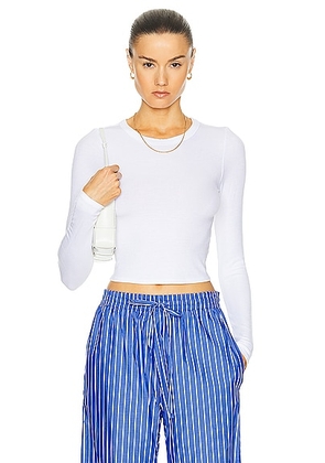 Enza Costa Silk Rib Cropped Long Sleeve Crew Top in White - White. Size L (also in M, S, XS).