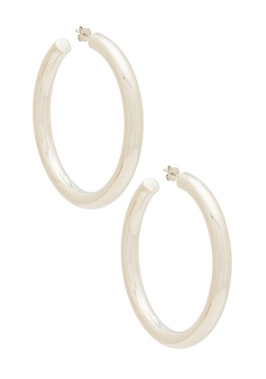 The M Jewelers NY The Thick Hoop Earrings in Metallic Silver.