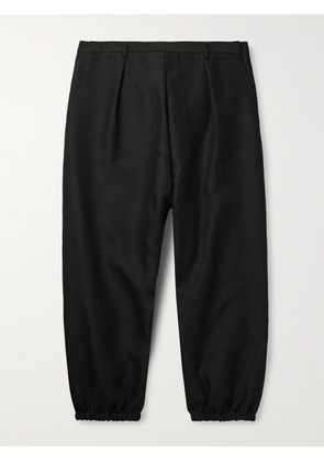 SAINT LAURENT - Tapered Pleated Linen and Cotton-Blend Trousers - Men - Black - IT 48
