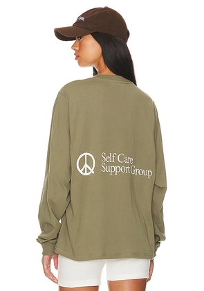 Museum of Peace and Quiet Support Group Long Sleeve T-shirt in Olive. Size XS.