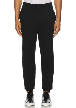 Lacoste Organic Cotton Sweatpants in Black. Size 3 / S, 4 / M, 6 / XL.