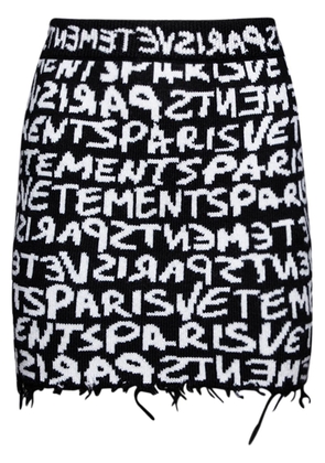 VETEMENTS monogram-jacquard merino miniskirt - Black