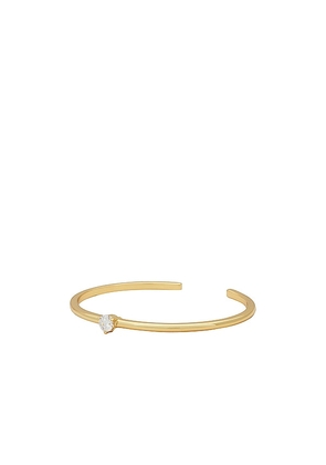 SHASHI Solitaire Bracelet Cuff in Metallic Gold.