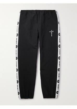 SAINT Mxxxxxx - Tapered Logo-Embroidered Striped Nylon-Twill Track Pants - Men - Black - S
