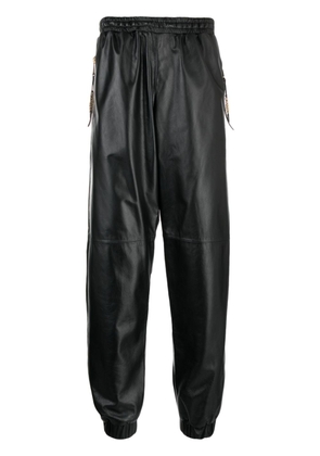 Moschino cropped leather track pants - Black