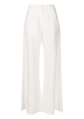 Adriana Degreas flared linen-blend trousers - White