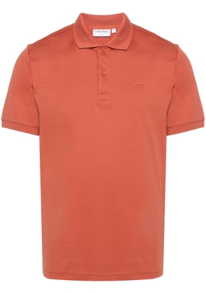 Calvin Klein logo-patch cotton polo shirt - Orange