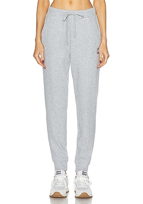 alo Muse Sweatpant in Athletic Heather Grey - Grey. Size L (also in M, S).