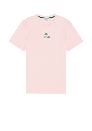 Lacoste Regular Fit Tee in Coral. Size M, S, XL/1X.